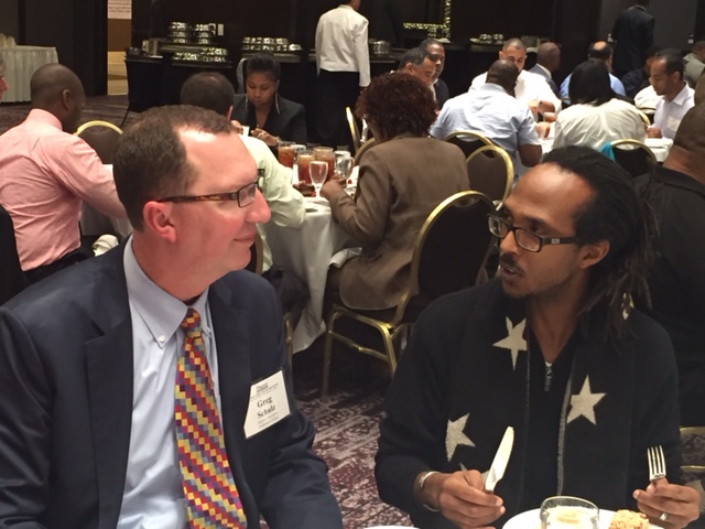 Interim President Greg Schulz with student Brian Fort