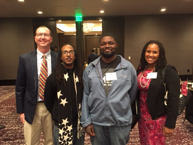 Greg Schulz with Umoja Faculty Coordinator Tamieka Hunter and students Brian Fort and Andrew Washington