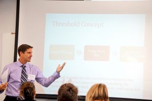 Dr. Miguel Powers stands and lectures to a Fullerton College class. He is the 2018 Teacher of the Year. 