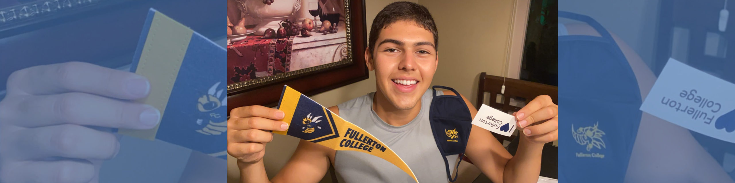 A happy 2020 freshman holds up a Fullerton College pennant and mask